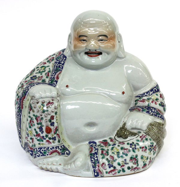 Chinese Enameled Porcelain Budai, Republic Period: Chinese polychrome enameled porcelain figure of Budai, Republic period, fashioned with a joyous face heightened by blushing cheeks and red lips, seated in a position of royal ease and holding a large