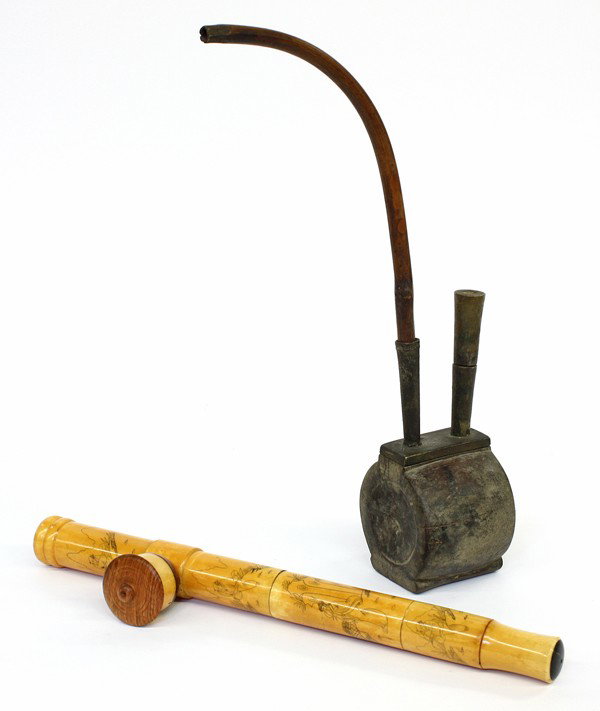 Two Chinese Opium Pipes: (Lot of 2) Chinese opium pipes, the first a pipe composed of a bamboo stock set into a metal fitting mounted on ovoid form wooden body, 14.25''h; together with a pipe of pieced bone construction, inci