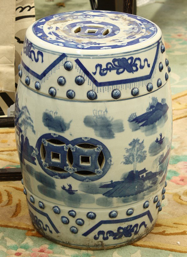 Chinese Blue-and-White Garden Seat, Landscape: Chinese blue-and-white porcelain garden seat, decorated with a continuous scene of a riverscape with figures and villas along the banks, all set within bands accented by Daoist treasures and raised bo