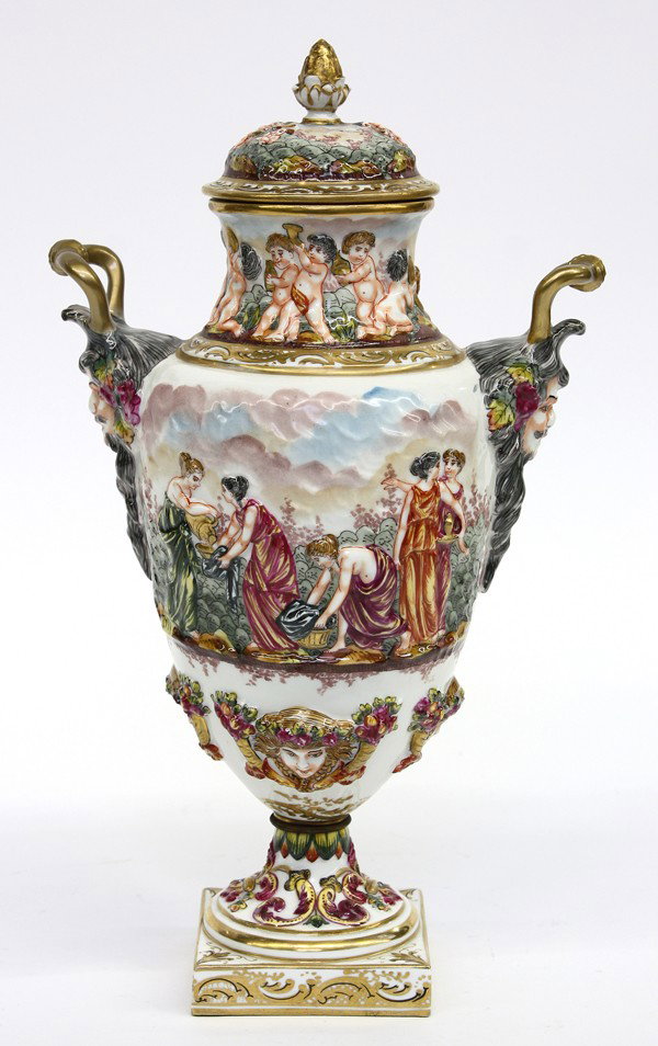 Capodimonte ewer: Capo di Monte porcelain handled ewer, the gilt and polychrome decorated body with classical genre scenes depicting beauties flanked with gilt decorated figural handles terminating at the square plinth