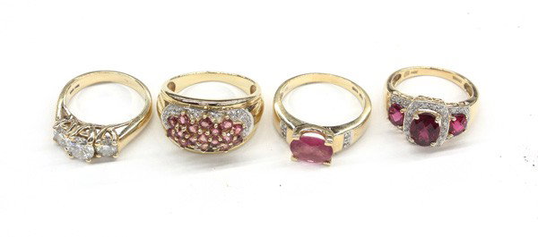 Collection of rings: (lot of 4) Lady's rings; all of 14k yellow gold, three having pink tourmaline and diamond detail and one three stone with moissanite. Total weight of rings 11.2 grams