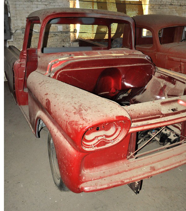 1958 Chevrolet Cameo Pickup: Circa 1958 Chevrolet Cameo Pickup, red. Straight body, no motor, hood, or doors present. Interior present. Additional parts and body panels in back room of building, too dark to properly inventory the