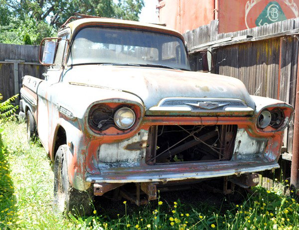 1958 Chevrolet Pickups: (lot of 2) Circa 1958 Chevrolet Pickups, 1 faded red, 1 grey. Both with no engines, both missing grilles, for restoration or parts. Red truck has no interior, grey truck has interior but with broken d