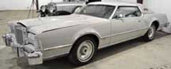1974 Lincoln Mk IV Coupe: 1974 Lincoln Mk IV Coupe, grey, VIN: 6Y89A848785. Cartier edition. Odometer shows 46,032 miles. Nice condition, good paint, appears original. Well-preserved car.