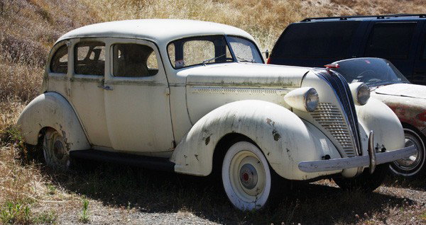 1937 Hudson Terraplane Sedan: 1937 Hudson Terraplane 4-Door Sedan, white. Odometer shows 75,598 miles. For restoration, appears largely complete.
