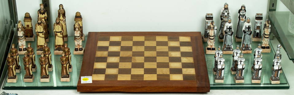 Painted composition figural chess set with inlaid game board: Painted composition figural chess set with inlaid game board, greatest 5.25"h.