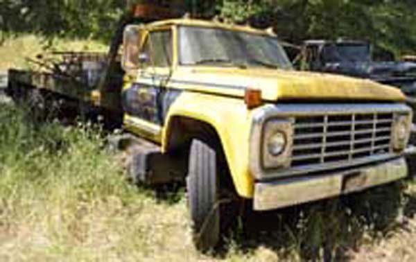 1974 Ford Rollback: Circa 1974 Ford Rollback, yellow. Appears complete but in rough shape, sitting outdoos for a long period.