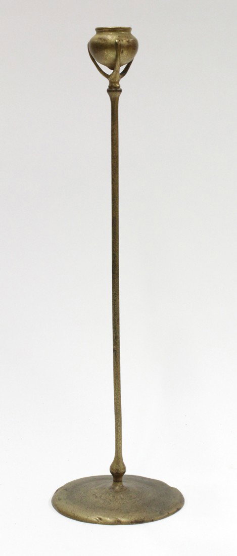 Tiffany Studios, New York, candlestick: Tiffany Studios, New York, dore bronze candlestick model 1213, having a bulbous top surmounting the long tapering standard terminating at the circular base, impressed Tiffany Studios New York, and num