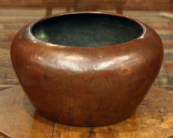Dirk Van Erp jardiniere: Large Dirk Van Erp hammered copper vase circa 1911, the bulbous form having an inward rolled rim above the tapering body retaining an original patina and impressed with a closed box mark, 7.5''h x 13'