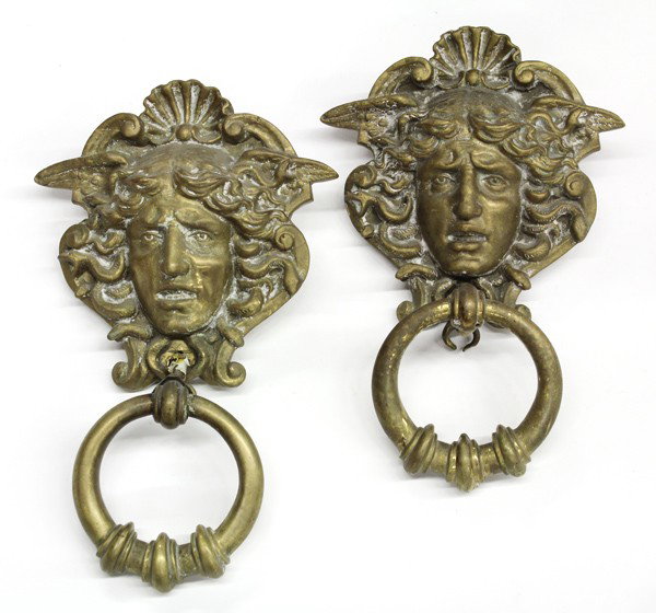 Pair of brass Medusa door knockers: (lot of 2) Pair of brass Medusa door knockers, modelled after the gates on the Royal Palace of Turin, each with her face surrounded by serpents and and a pair of wings, both 13''h x 9''w
