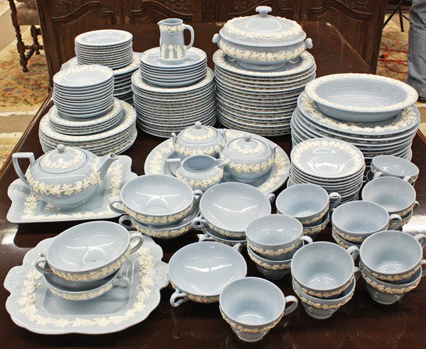 Wedgwood table service: (lot of 112) Wedgwood embossed Queens Ware table service, each having a grape leaf and vine border on a blue ground, consisting of eleven service plates 10.5'', eighteen dinners, eight luncheon 9'', s