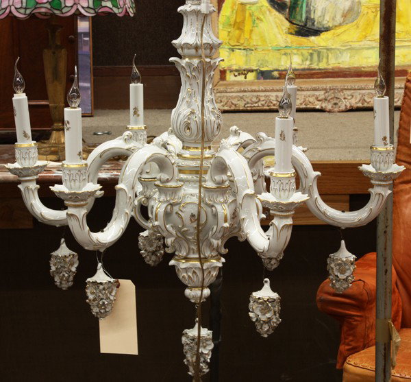 Rococo style chandelier: Rococo style porcelain chandelier, executed by Von Shierholz Germany circa 1920, the partial gilt decorated porcelain standard supporting the six lights having floral drops, overglaze mark on ceiling 