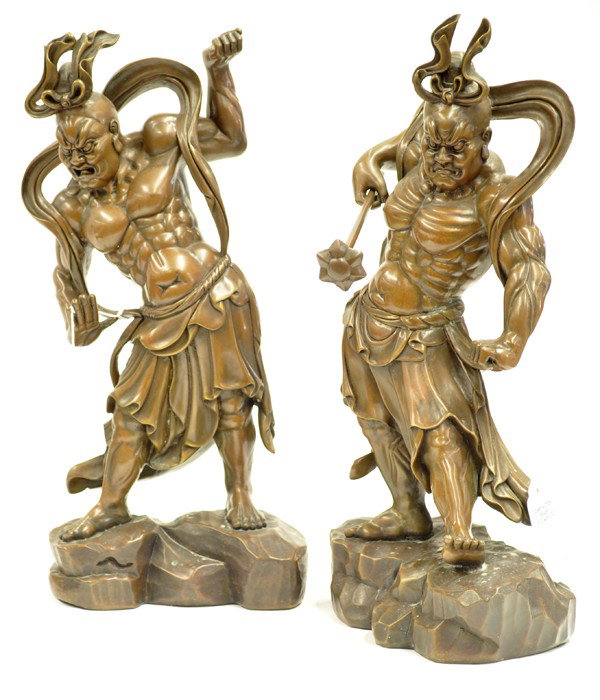 Pair Japanese Patinated Bronze Guardian Figures: Pair of Japanese patinated bronze guardian figures, the two Kongorikishi (or Nio) standing in dynamic poses on rockwork, each well-defined muscular torso clothed in a dhoti-like garment and fluttering