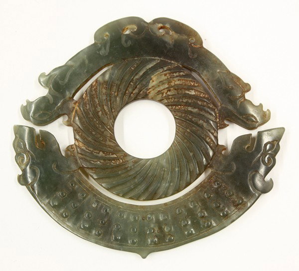 Chinese Archaistic Jade Bi Disk: Chinese archaistic jade disk, centered with a rope patterned bi bracketed by two huang-form bands with one modelled with a two-headed mythical beast with scrolls to the body, the other shaped with two
