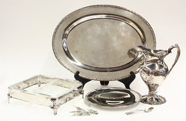 Silverplate table articles: (lot of 8) Silverplate table articles including a covered server with a hot water resevoir, hand chased tray and ewer with grape on vine motif, reticulated chafing stand with two glass inserts, makers