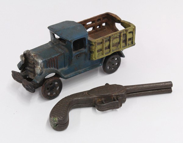 Cast iron group: Early cast iron including a painted truck, 3'h x 8''w, and a boot jack fashioned as a double barrel pistol, medallion inscribed ''American Bull Dog Boot Jack'' 7.75''l