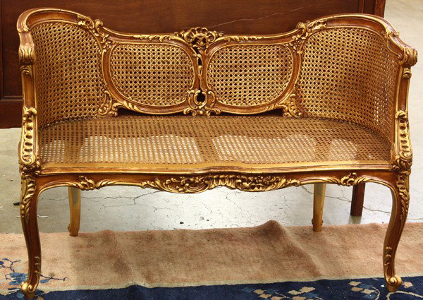 Rococo style settee: Rococo style gilt decorated caned back settee