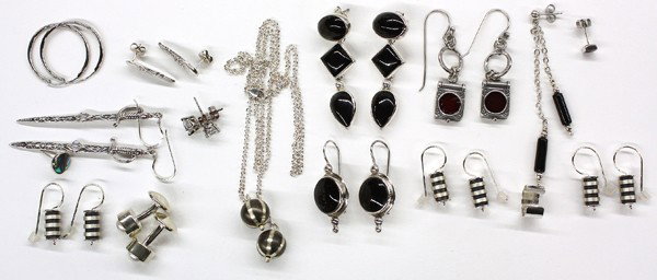 Miscellaneous sterling silver jewelry items: Collection of miscellaneous sterling silver jewelry items, including; eleven pairs of earrings; one single earring; pair of cufflinks with pearls and a chain necklace with hanging silver oxy balls. Th