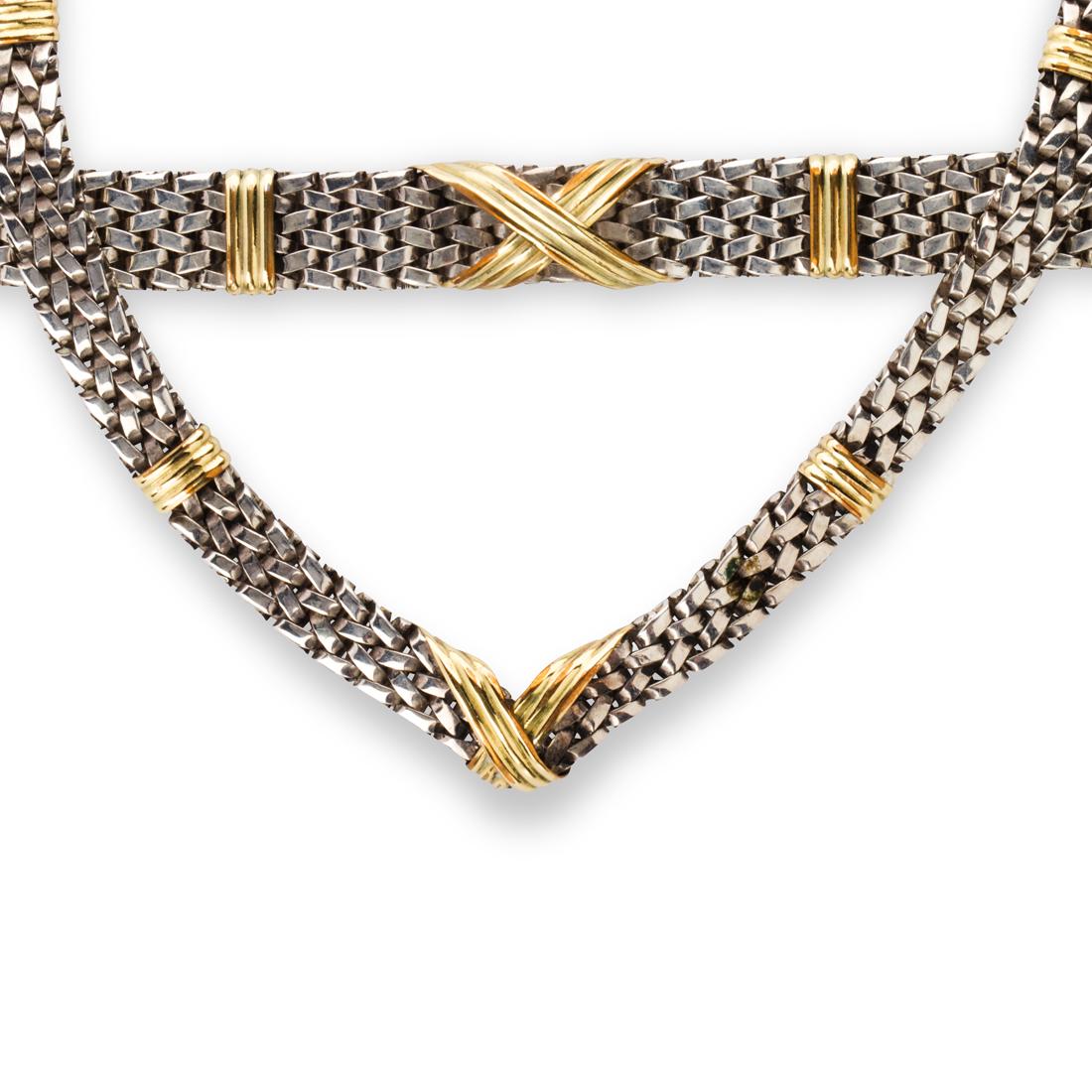 A silver bracelet and bracelet suite: A silver bracelet and bracelet suite including a bracelet and a necklace, designed as fancy link silver chains featuring "X" motif between fluted bars in fourteen karat gold.Property of a Hillsborough