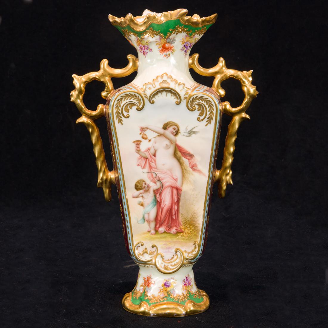 A Vienna style porcelain cabinet vase: A Vienna style porcelain cabinet vase, painted with Venus and Cupid and two putti, reserved on a gilt highlighted ground, overglaze blue shield mark, titled and numbered, 9.25"h.