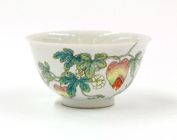 Chinese Enameled Porcelain Tea Cup, Flowers/Bambo: Chinese enamel decorated porcelain tea bowl, of inverted bell form brightly enameled with a scrolling sprig issuing small yellow flowers and pink yellow buds further accompanied with bamboo and multi-