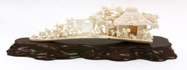 Japanese Ivory Carving, Taisho/Showa: Japanese ivory tableau (okimono), Taisho/Showa period, realistically carved as a village scene with diminutive figures actively harvesting seashells, catching fish, carrying produce or arriving back f