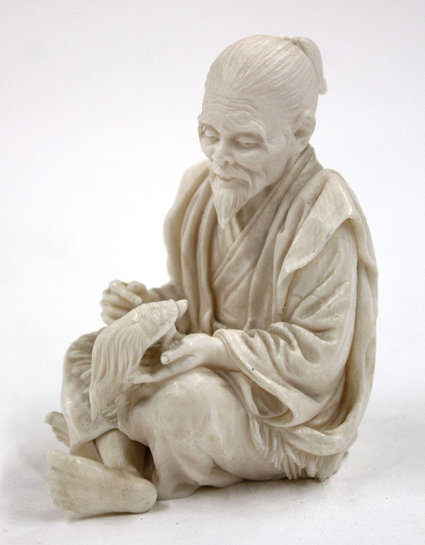 Japanese Ivory Figural Carving, Urashimataro: Japanese ivory figural carving, depicting Urashimataro (a type of Japanese Rip Van Winkle) realistically rendered an elderly man seated in kimono and straw apron and holding a minogame (type of turtle