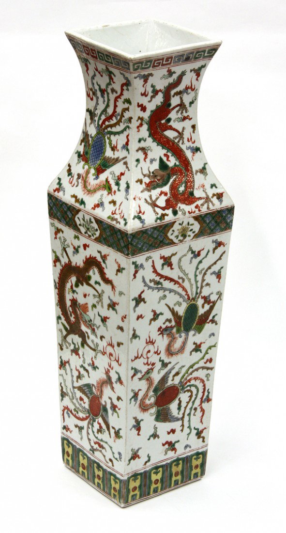 Chinese Enameled Porcelain Vase, Dragon/Pheonix: Chinese enameled porcelain square section vase, of baluster form, each side with writhing dragon and phoenix contesting for a sacred jewel amid a ground scattered with colored cloud scrolls, the neck 