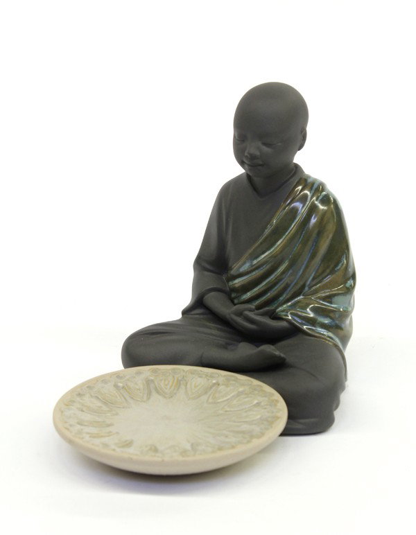 Lladro figurine: Lladro figurine of a Buddhist Monk in meditation seated in front of an incense cone burner, 5.25''h x 6.5''l