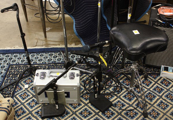 Audio equipment: (lot of 12) Group of microphones and stands, including a Shure KSM27 microphone, three Oktava MK-012-01 microphones, and a Sennheiser E935 microphone; together with a stool, guitar rack and stand, etc