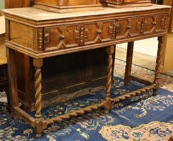 William and Mary style sideboard: William and Mary style oak sideboard, the two drawers having geometric panelled fronts and rising on barley twist legs, 35.5''h x 60''w x 18''d