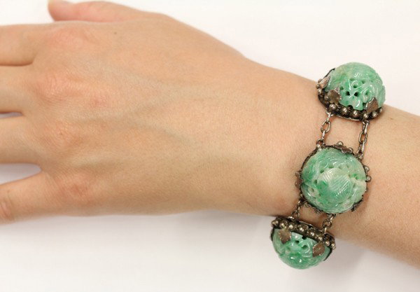 Jade Cabochon Silver Tribe Bracelet: Jade cabochon bracelet; mounted in silver, carved and domed jade