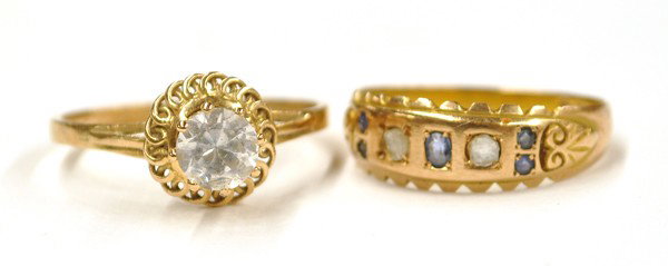 Two yellow gold rings: Two yellow gold rings, including; one (stamped) 15k with blue sapphires and diamond chip accents. Total ring weight 2.5 grams. Ring size 6.25 and one colorless stone solitaire in 14k gold. Total ring 