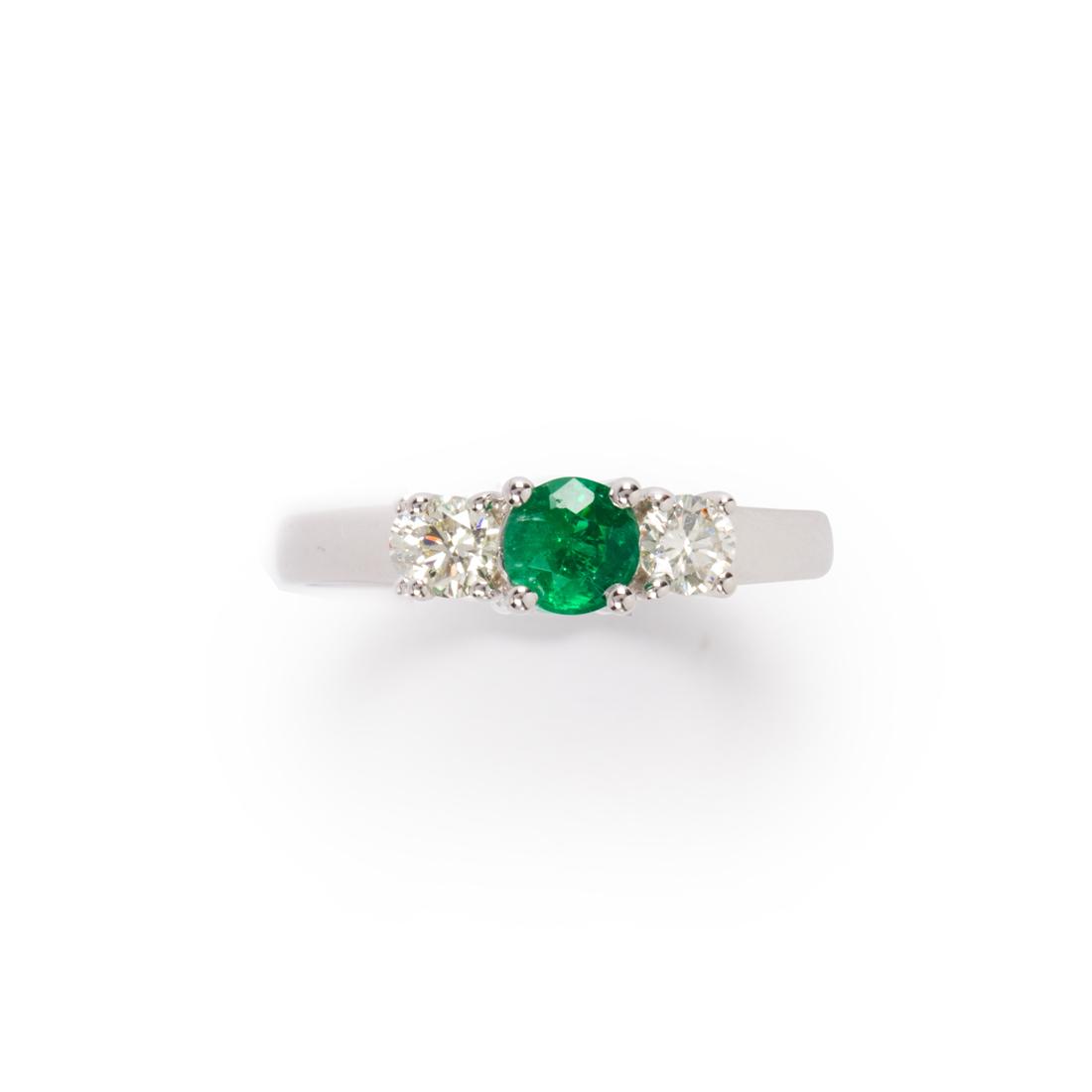An emerald, diamond and fourteen karat white gold ring (1 of 2)
