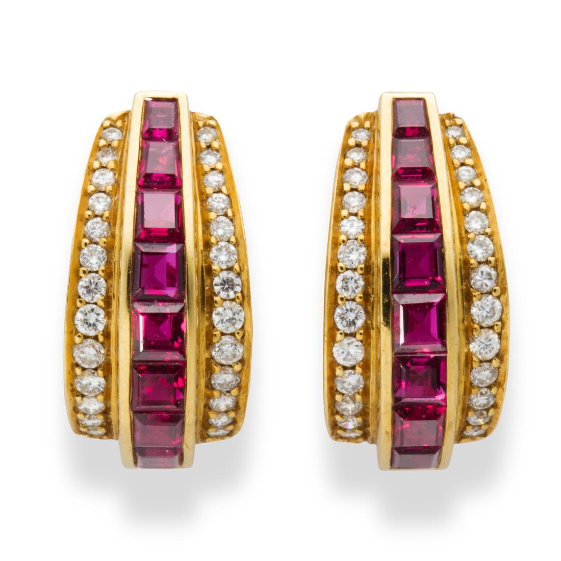 A pair of ruby, diamond and eighteen karat gold earrings: A pair of ruby, diamond and eighteen karat gold earrings each designed as a huggie set with a line of square-cut rubies between round brilliant-cut diamonds; estimated total ruby weight: 2.40 carats. 