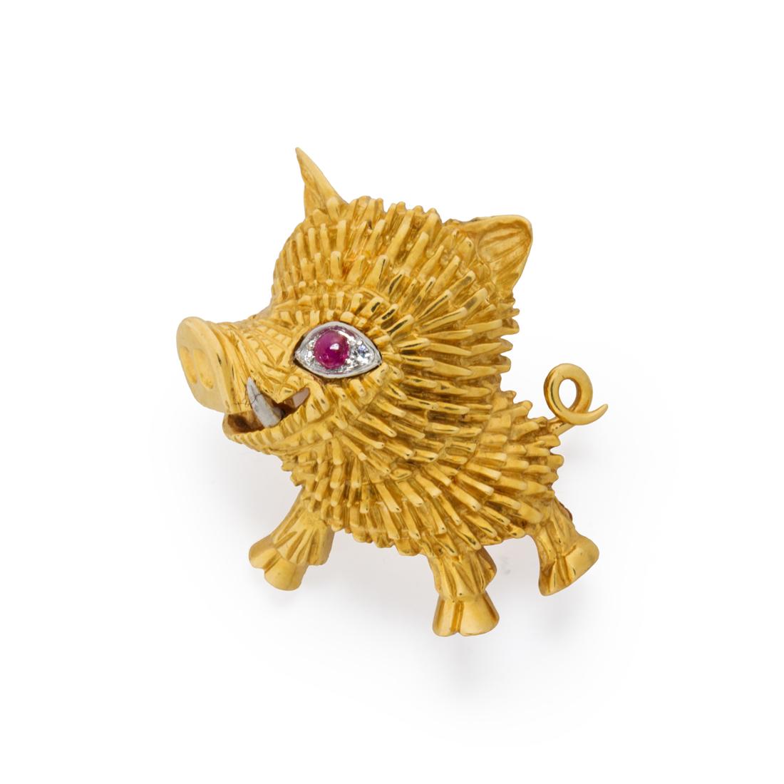 A gemstone and eighteen karat gold brooch, Hammerman Brothers: A gemstone and eighteen karat gold brooch, Hammerman Brothers the wild boar form, featuring round ruby cabochon and single-cut diamond set eye and tusk in platinum. 11.4 dwt; length: 1 1/4 in