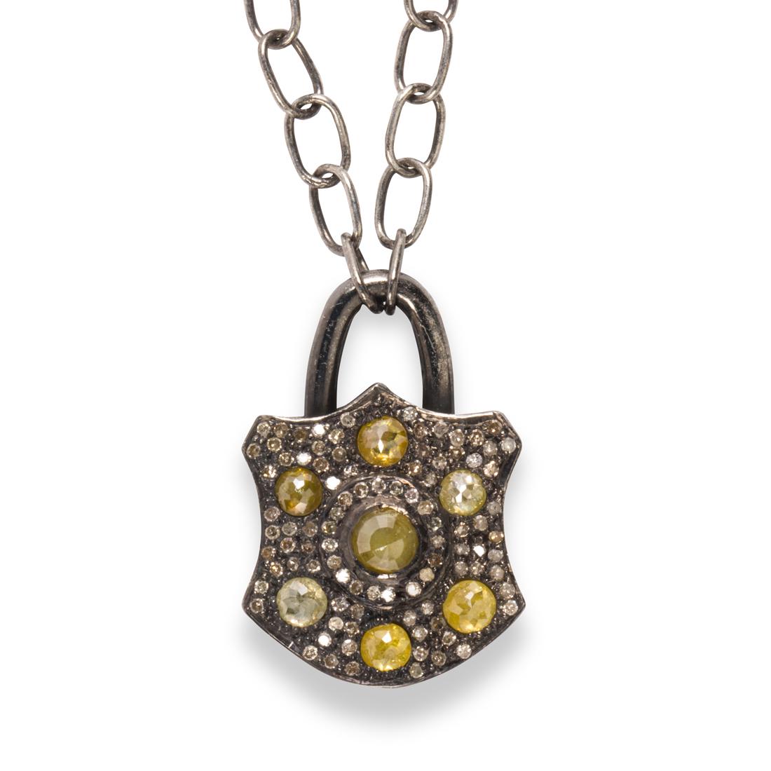 A yellow diamond and diamond pendant necklace (1 of 2)
