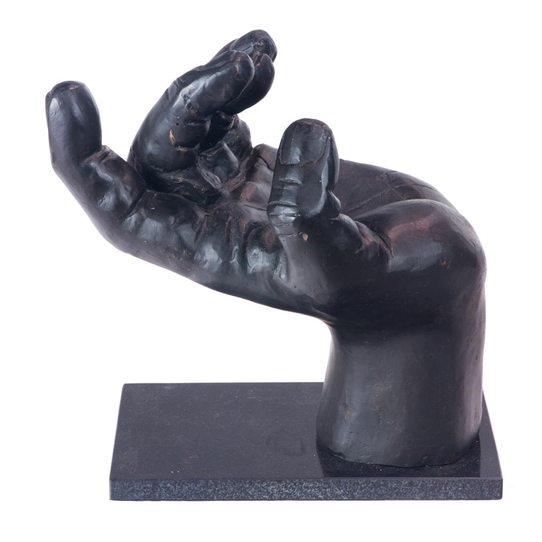 Arteriors Garrick hand sculpture: Arteriors Garrick hand sculpture, bronze cast iron, rising on a polished black granite base, 12"h