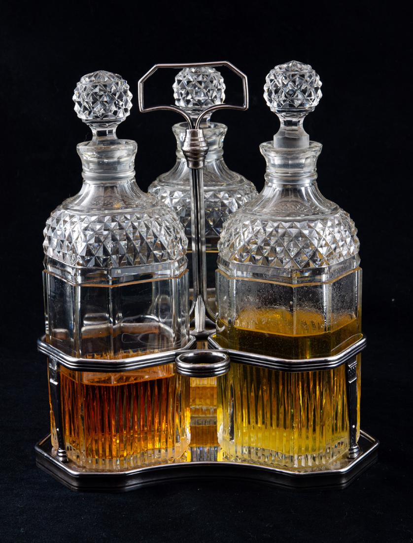 European silverplated triangular form caddy with (3) cut glass square decanters (1 of 1)