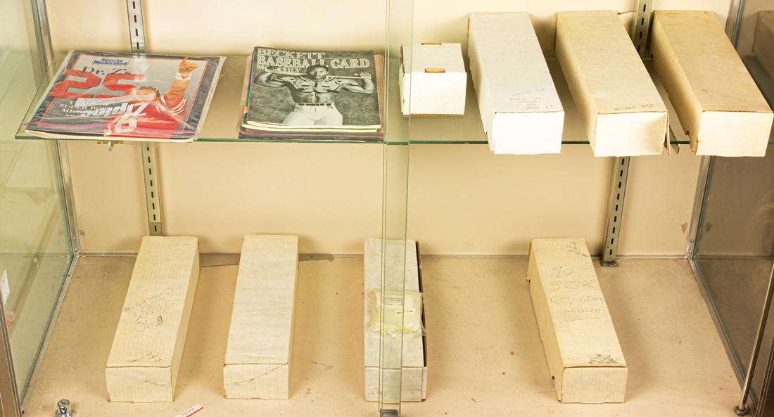 Two shelves of baseball memorabilia and cards: Two shelves of baseball memorabilia and cards, including (6) 800-card storage boxes with Donruss,The Topps 'Turn Back the Clock' and Score cards, etc.