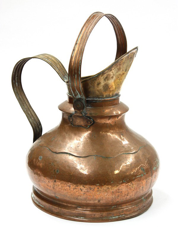 Belgian Hammered copper pail: Belgian Hammered copper pitcher circa 1900, having a bulbous body with a rivet fastened adjustable handle and rising on a circular base, 16''h
