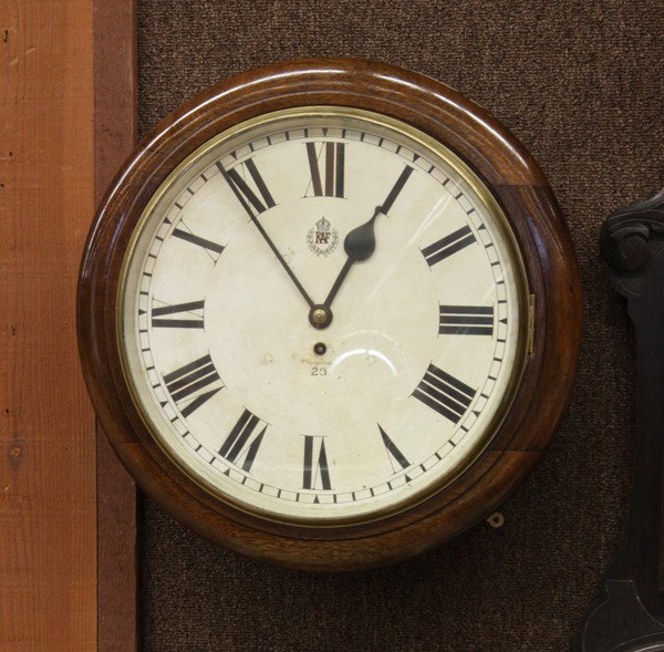 T.W. Elliot RAF squadron clock: English T.W. Elliot R.A.F. (Royal Air Force) squadron clock, movement marked with name and date, 1939, housed in a mahogany case, the face with Roman numerals, and the RAF insignia, 19''h x 19''w x 7'