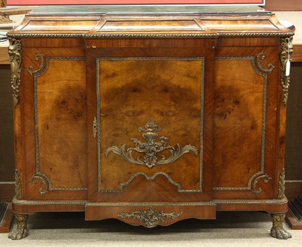 Neoclassical style credenza: Neoclassical style credenza, having an inset marble top above the patinated metal mounted case centering the burl panels and rising on cast paw feet, 41''h x 51''w x 20''d. Provenance: From the Estate