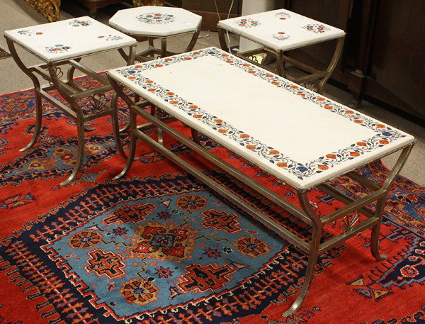 Pietra Dura suite: (lot of 4) Pietra Dura suite, each piece having a white marble top inlaid with mixed stones including carnelian, agate, and mother of pearl of floral reserves, rising on a silvered wrought base termin