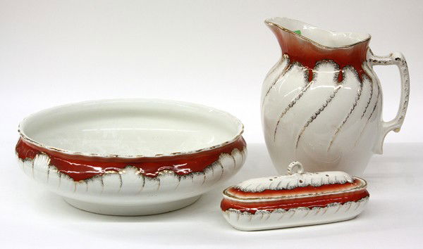 Ceramic pitcher and basin: (lot of 3) Art Deco pitcher and basin set, each having a polychrome decorated body with gilt accents, made in Belgium, 12''h