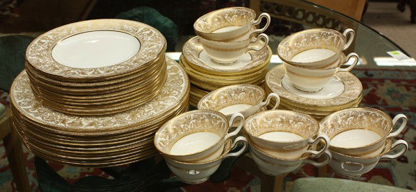 Wedgwood Florentine table service: (lot of 60) Wedgwood ''Gold Florentine'' pattern table service with four pieces per place setting including twelve dinner plates 10.75''w, salad plates 8''w, twelve bread and butter plates 6'', and tw
