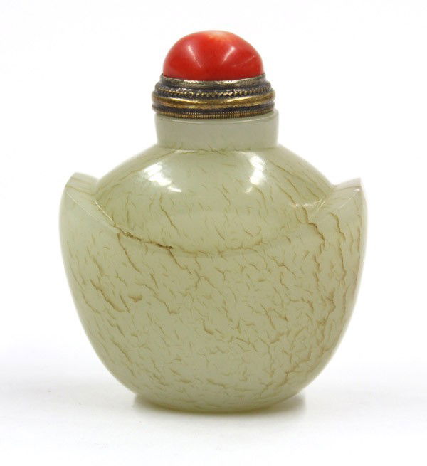 Chinese Jade Snuff Bottle, Ingot: Chinese russet mottled celadon jade snuff bottle, of ingot form and carved a short cylindrical neck, the overall stone of a gray-tinged celadon hue suffused with light brown striations, 2''w