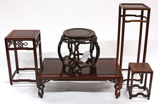 Group of Chinese Wooden Stands: (Lot of 5) Assortment of Chinese wooden stands, consisting of three of flower-stand form, each with a square top raised on long slender supports braced by humpback stretchers; a barrel stand with a fl
