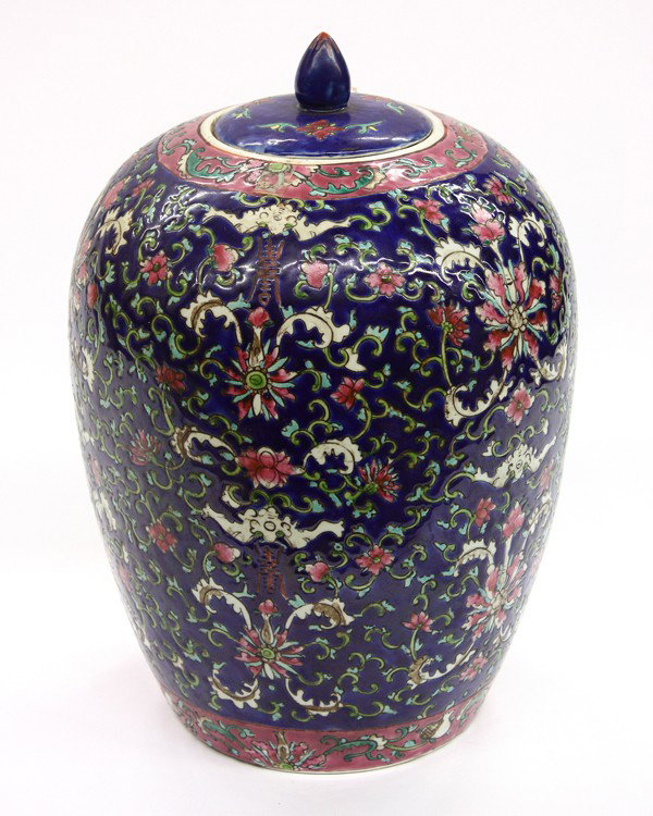 Chinese Enameled Porcelain Jar: Chinese polychrome enameled porcelain covered jar, the ovoid body decorated overall with a dense pattern of lotus and meandering tendrils accented with bats and shou medallions executed in hues of pin