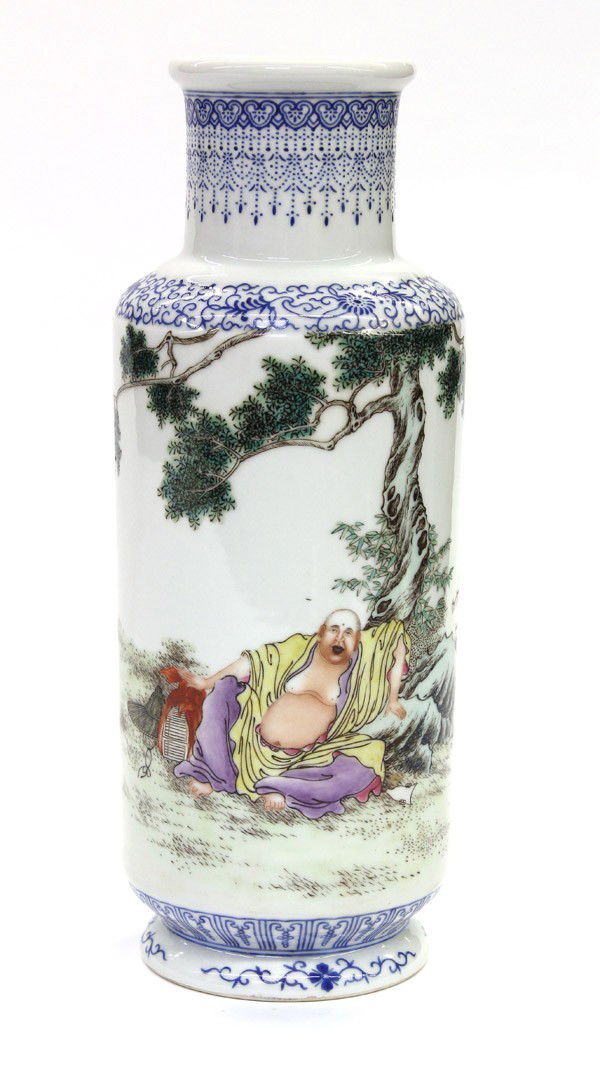 Chinese Enameled Porcelain Vase, Budai: Chinese polychrome enameled porcelain rouleau vase, painted with Budai draped in a yellow robe and purple lower garment while seated under a tree with hand resting on a bundle of books set beside a ha